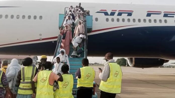 Hajj pilgrims alighting from an aircraft