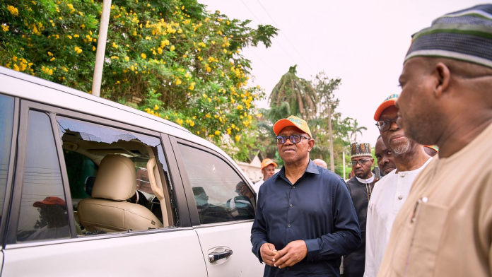 Obi and some of the ADC chieftains are examining the damaged cars and bullet-riddled gates after the attack by the assailants in Edo State on Tuesday